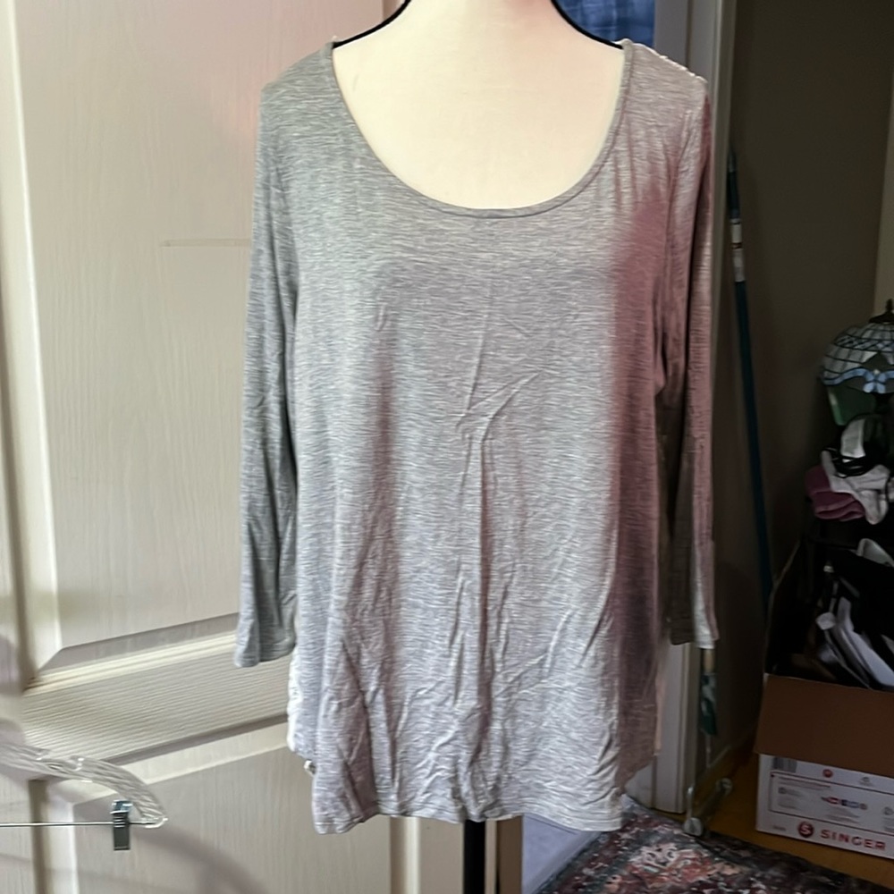 This is simply beautiful! Such a unique top with the lace on the back!